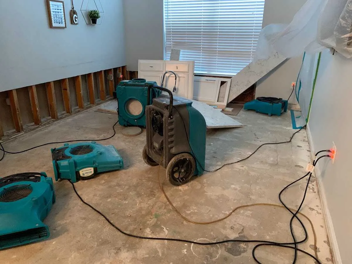 Dehumidifier in flood-cut room for Water Damage Restoration in Bow