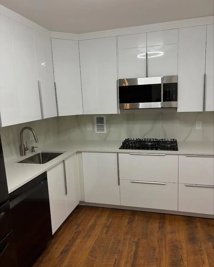 Restored kitchen with white cabinets after water damage in Bow
